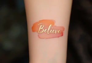 "Believe" in a brushstroke of gold with a faded sunset orange gradient in the background, capturing optimism and a bright future. tattoo idea