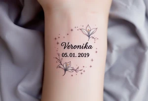 Veronika 05. 01. 2019) – Soft white lilies framing Veronika’s birthdate, accented by silver twinkling stars and gentle, sparkling details. tattoo idea