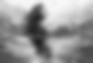 girl floating on still water with ripples bouncing off of her tattoo idea