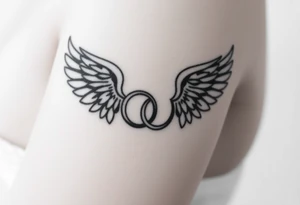 two wedding rings combined with angel wings tattoo idea