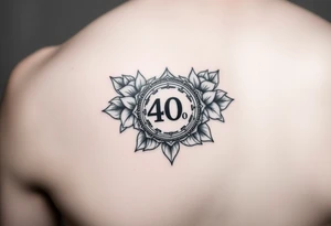 Shoulder tattoo that has a 40 year AA coin medallion with lotus flowers surrounding it tattoo idea
