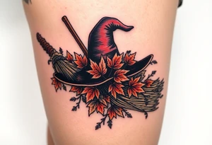 Which is broom with handle
 a witches hat with fall maple leaves, feathers and vines tattoo idea