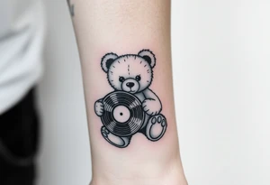 minimalist teddy bear holding a vinyl record tattoo idea
