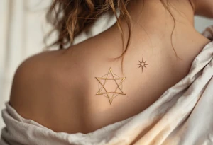 A gold eight-pointed star tattoo evokes celestial power and divine energy. tattoo idea