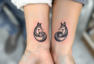 A black and white yin-yang formed by curled foxes on each partners wrist tattoo idea