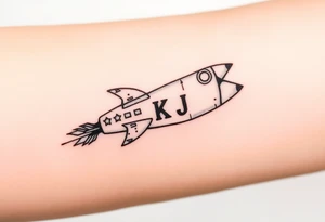 Rocket ship with letters K and J somewhere on it tattoo idea