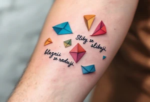 "Sliby se slibuji, blazni se raduji." — A string of colorful paper promises fluttering away in the wind, with the quote wrapped around in playful gray cursive. tattoo idea