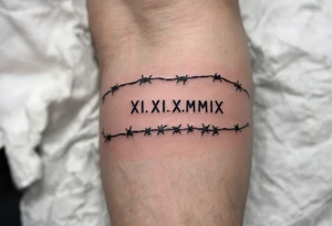 XI.XI.MMIX inked in matte black on the hand’s edge, accompanied by silver barbed wire surrounding it. tattoo idea