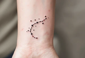 Black ink scales hang symmetrically beneath a Libra star constellation traced in fine white dots with red star accents. tattoo idea