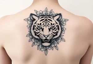 a whole tiger with some flowers around it tattoo idea