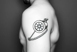 A sailboat winch located on forearm with a rope wrapped around it that leads to the wrist and the rope wraps around the wrist tattoo idea
