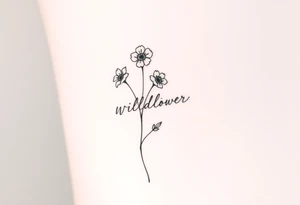 Wildflower written in stem tattoo idea
