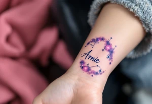 A galaxy-style tattoo with deep purples and blues, spelling out the son's name Arnie in constellation form. tattoo idea