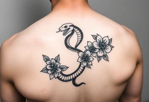 snake and flowers
thats feminine simple but still distinctive with some kind of background tattoo idea