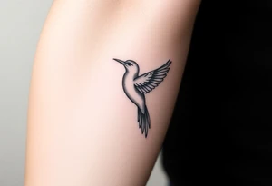 Feminine bird tattoo idea
