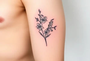 Feminine daffodils, Lily of the valley and larkspur bouquet tattoo idea