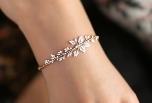 A thin, delicate gold band with intricate white filigree engravings, symbolizing timeless elegance and devotion. tattoo idea