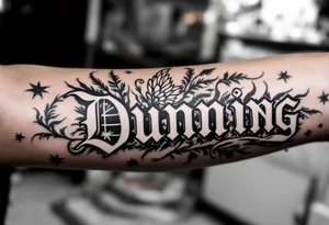 Dunning, left forearm details include angel wing on right side, greek type of font,jungle leaves, name is big and in white color tattoo idea