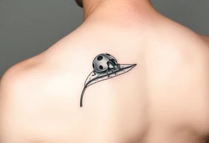 Ladybug reed sitting on a leaf tattoo idea