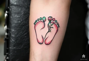 Soft coral and pastel green footprints of Dominik, accompanied by a small, blooming flower symbolizing his growth and beauty. tattoo idea