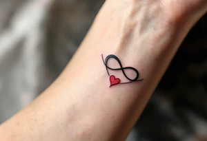 A delicate black infinity symbol merging into a soft red heart, representing eternal love tattoo idea