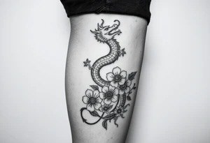 Leg area back of calf dragon going up 4 flowers tattoo idea