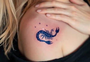 In the deep indigo sky, Scorpius coils like a celestial scorpion outlined in white light moving toward its star constellation tattoo idea