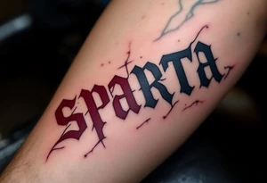 The word “SPARTA” written in Gothic script across the forearm, half in hockey red, half in football maroon. tattoo idea