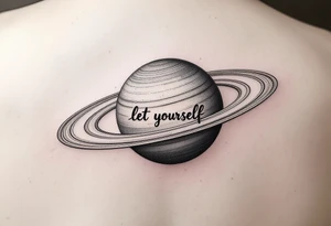 Minimalistic saturn planet, but the text «let yourself» is placed inside saturns rings tattoo idea