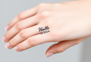 simple and elegant black ring with a delicate engraving of the wedding date tattoo idea