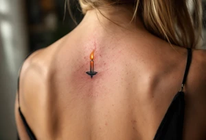 One wears a burning match in red and gold, and the other the lit candle it touches, showing how they ignite each other’s flame. tattoo idea