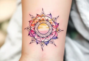 Boho-style “Pura Vida” with a mandala sun in ochre, terracotta, and soft pink behind it. tattoo idea