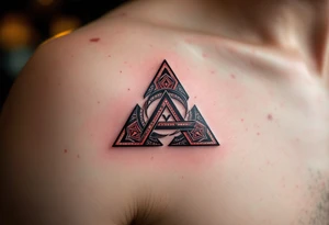 A bold triquetra, filled with deep red and black patterns tattoo idea