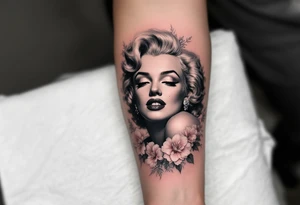 A romantic Marilyn Monroe portrait in soft grayscale, framed by delicate pink peonies and silver filigree. tattoo idea