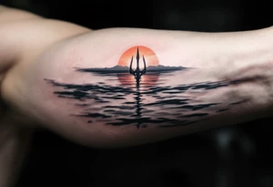 trident half way under calm water at sunset tattoo idea