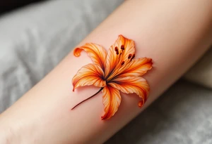 Orange glowing lily tattoo idea