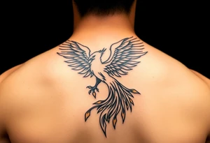 magnificent phoenix rising from golden flames with trailing embers tattoo idea