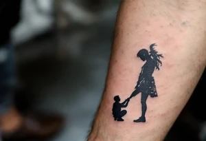 Tattoo of a father kneeling to tie his daughter’s shoes, drawn in detailed silhouette with slight warm gray shading. tattoo idea