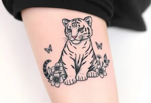 Tiger cub sitting down with flowers and butteflies tattoo idea