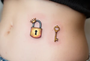 Matching tattoos of gold lock and key, one with a tiny crown, the other with a crown-shaped hole. tattoo idea