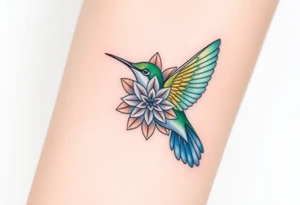 A hummingbird hovering near a Flower of Life, representing harmony and the energy of life. tattoo idea