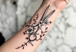 large haircutting scissors going from wrist to elbow with a large hawthorn flower, larkspur, daffodil and vine woven around up and down the arm tattoo idea