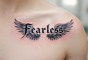 “Fearless” in steel gray Gothic style, flanked by wing motifs in faded charcoal. tattoo idea