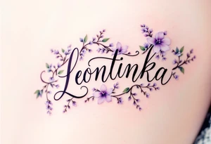Leontýnka written in elegant script, surrounded by delicate lilac vines with small white blossoms. tattoo idea
