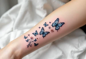 Tattoo of about 10 butterflies that look realistic and different sizes spaced out with some flower or vine tattoo idea