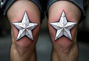 Distressed white stars with cracked textures, centered on each kneecap, resembling aged paint on concrete for a rugged look. tattoo idea