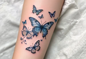 Tattoo of about 10 butterflies that look realistic and different sizes spaced out with some flower or vine tattoo idea