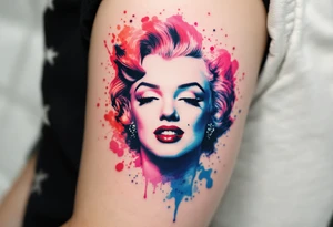 Watercolor Marilyn Monroe tattoo with splashes of red, pink, and blue around a classic black-lined face. tattoo idea