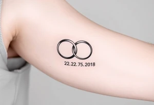 two wedding rings as symbol of infinity with date 22. 7. 2018 tattoo idea