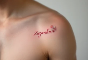 Zuzanka written in gentle cursive, nestled among pastel pink and white daisies tattoo idea